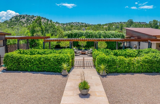 24 Whispering Spirits Dr, Cerrillos, NM 87010 - view of yard with a mountain view and a gate