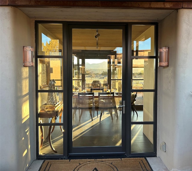 24 Whispering Spirits Dr, Cerrillos, NM 87010 - view of exterior entry with stucco siding