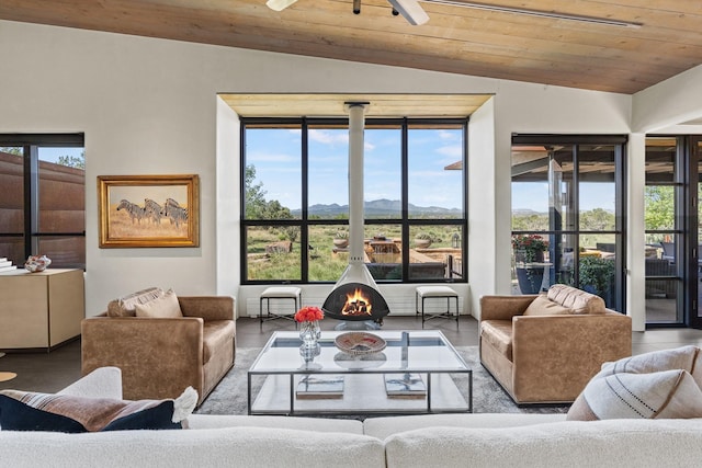 24 Whispering Spirits Dr, Cerrillos, NM 87010 - living room with a mountain view, wooden ceiling, lofted ceiling, and a ceiling fan