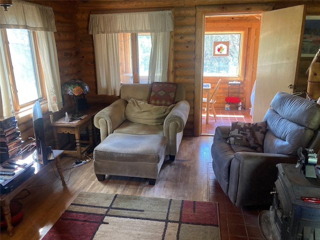 32 Doe Rim Loop, Los Ojos, NM 87551 - living room featuring log walls, healthy amount of natural light, and hardwood / wood-style floors