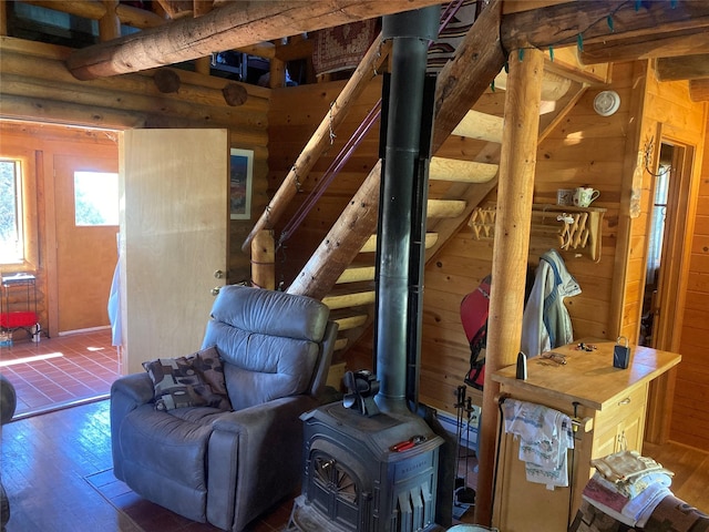 32 Doe Rim Loop, Los Ojos, NM 87551 - living room with a wood stove, wood finished floors, wooden walls, and rustic walls