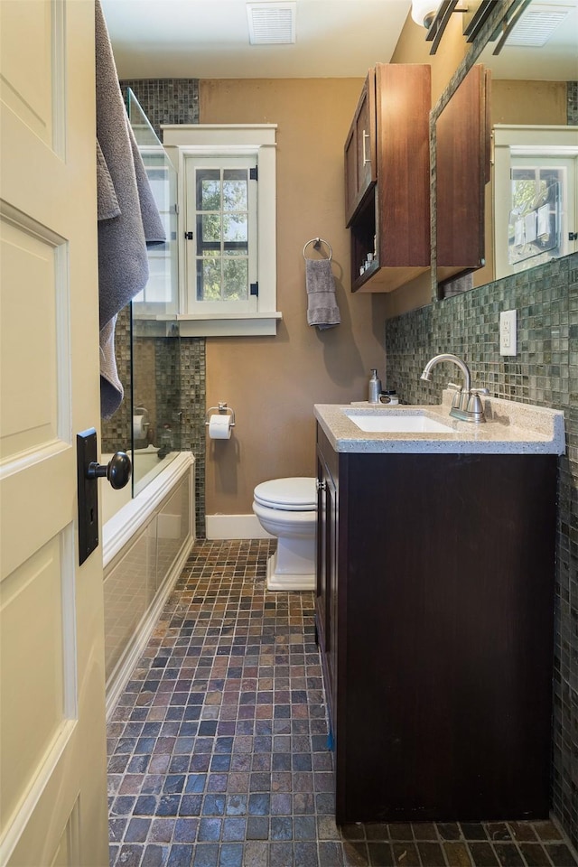 111 E Santa Fe Unit 5, Santa Fe, NM 87505 - full bathroom featuring double vanity, backsplash, and tiled shower / bath combo