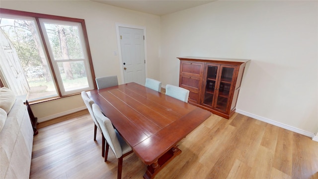 2374 36th Unit B, Los Alamos, NM 87544 - dining room featuring light wood-type flooring and healthy amount of natural light