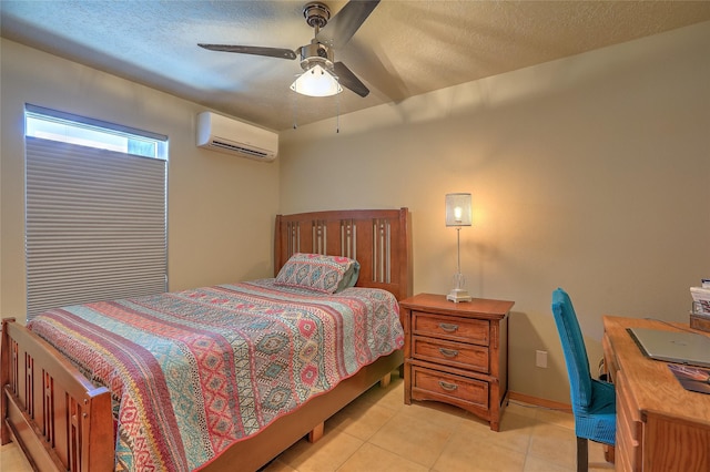 7513 Kachina Loop, Santa Fe, NM 87507 - bedroom featuring a wall unit AC, light tile patterned flooring, a textured ceiling, and ceiling fan