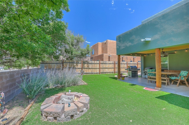 7513 Kachina Loop, Santa Fe, NM 87507 - fenced backyard with a fire pit, a patio, and ceiling fan
