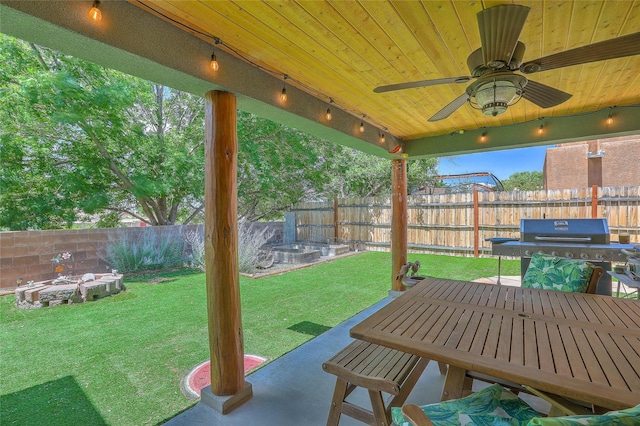 7513 Kachina Loop, Santa Fe, NM 87507 - fenced backyard featuring a grill, ceiling fan, and a patio
