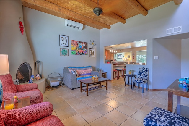 7513 Kachina Loop, Santa Fe, NM 87507 - living room with a wall mounted air conditioner, a wood ceiling with exposed beams, light tile patterned floors, and a chandelier