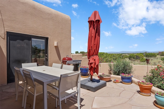 8 Antigua Ct, Santa Fe, NM 87508 - view of patio / terrace with a mountain view and outdoor dining area
