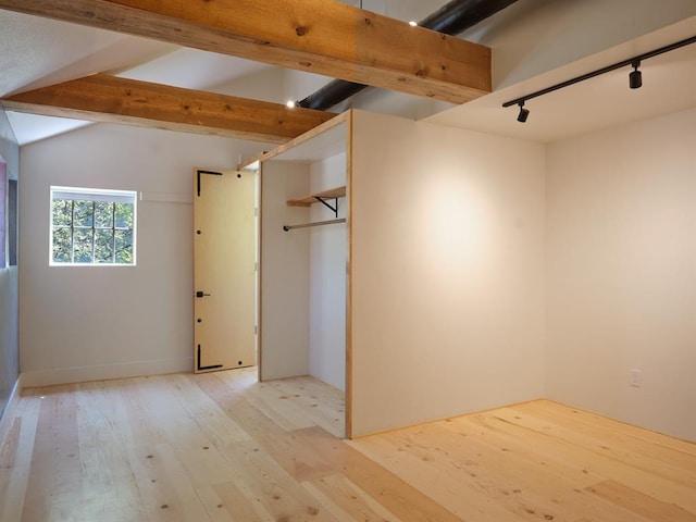 1918 Hopewell Unit C, Santa Fe, NM 87505 - unfurnished bedroom with light wood-style flooring and rail lighting
