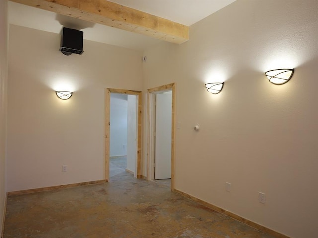 1918 Hopewell Unit C, Santa Fe, NM 87505 - unfurnished room featuring baseboards and beam ceiling