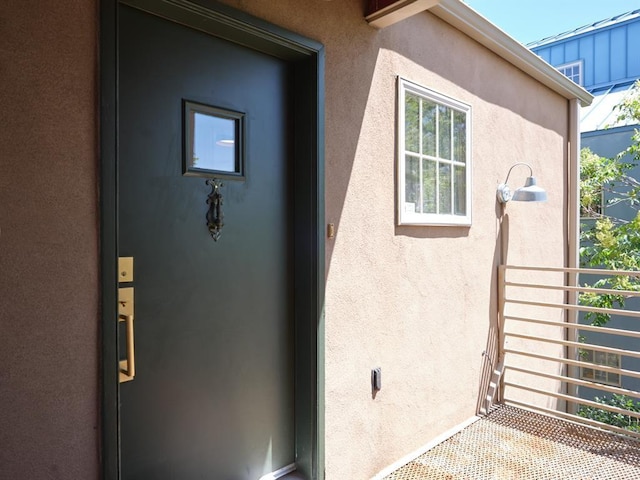 1918 Hopewell Unit C, Santa Fe, NM 87505 - doorway to property with stucco siding and a balcony
