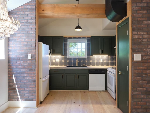 1918 Hopewell Unit C, Santa Fe, NM 87505 - kitchen with white appliances, light wood-style floors, light countertops, decorative backsplash, and brick wall