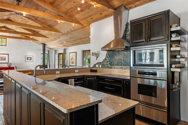 10 Sabina Ln, Santa Fe, NM 87508 - kitchen with wall chimney exhaust hood, stainless steel appliances, wooden ceiling, plenty of natural light, and light stone counters