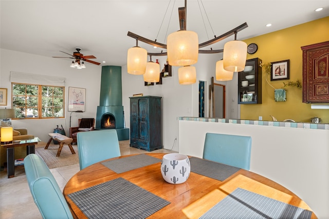 10 Sabina Ln, Santa Fe, NM 87508 - dining area featuring recessed lighting, ceiling fan, and a wood stove