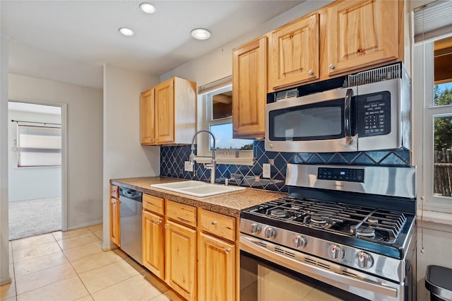 79 Moya Rd, Santa Fe, NM 87508 - kitchen featuring stainless steel appliances, backsplash, light carpet, light brown cabinets, and recessed lighting