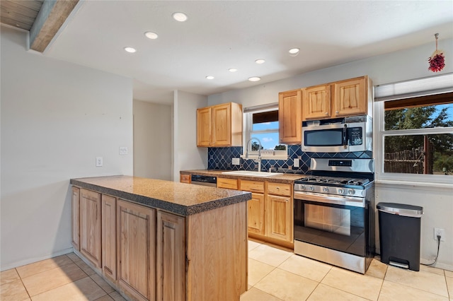 79 Moya Rd, Santa Fe, NM 87508 - kitchen featuring appliances with stainless steel finishes, tasteful backsplash, a peninsula, recessed lighting, and light brown cabinetry