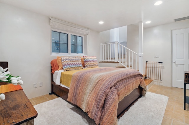 605 Acequia Madre, Santa Fe, NM 87505 - bedroom featuring light tile patterned flooring and recessed lighting