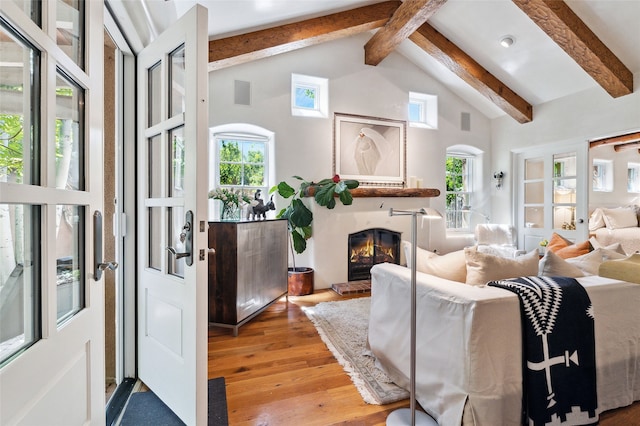 605 Acequia Madre, Santa Fe, NM 87505 - living area with a fireplace, healthy amount of natural light, and hardwood / wood-style floors