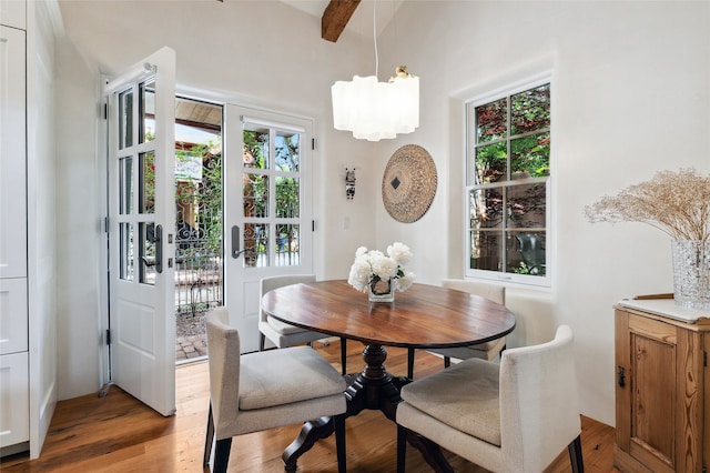605 Acequia Madre, Santa Fe, NM 87505 - dining room with a chandelier and light wood-style flooring
