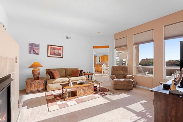 4704 Contenta Rdg, Santa Fe, NM 87507 - living area featuring carpet and a glass covered fireplace