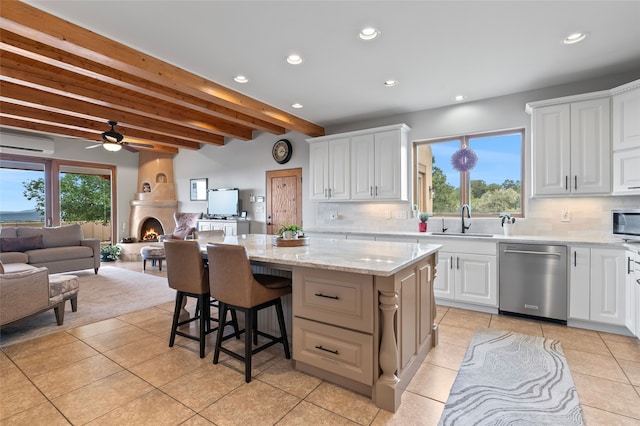 17 Sueno De Santa Fe, Santa Fe, NM 87505 - kitchen with dishwasher, a wall mounted AC, beam ceiling, backsplash, and a kitchen island