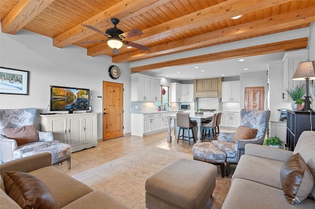 17 Sueno De Santa Fe, Santa Fe, NM 87505 - living area featuring light tile patterned floors, ceiling fan, a wooden ceiling with exposed beams, and recessed lighting