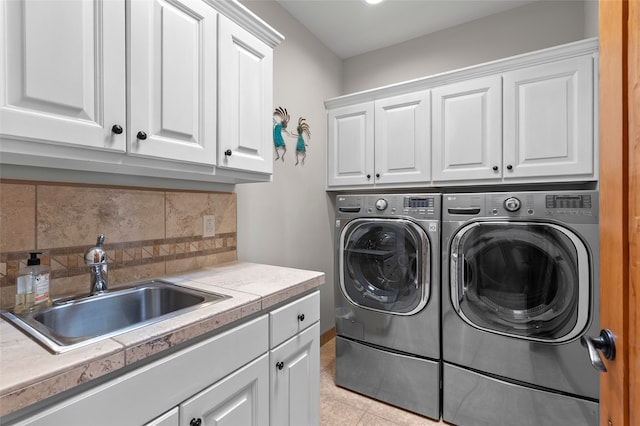 17 Sueno De Santa Fe, Santa Fe, NM 87505 - laundry room featuring cabinet space, separate washer and dryer, and light tile patterned floors