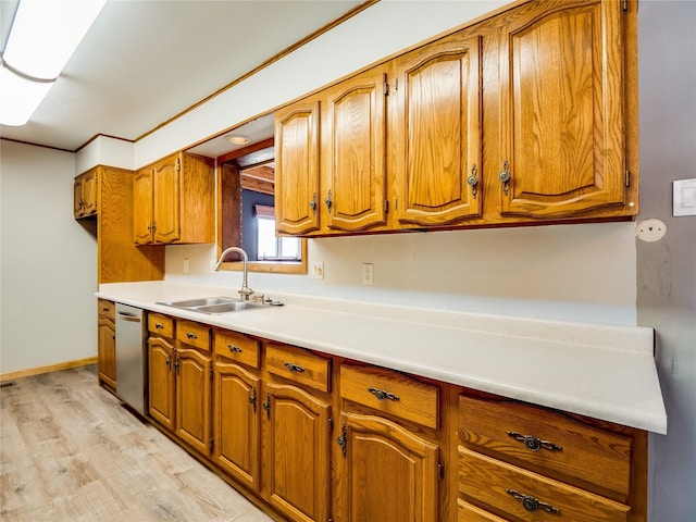 85 Chiquita Dr, White Rock, NM 87547 - kitchen featuring stainless steel dishwasher, brown cabinetry, light countertops, and light wood-style flooring