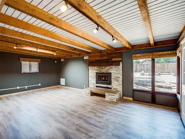 85 Chiquita Dr, White Rock, NM 87547 - unfurnished living room with track lighting, wood finished floors, a fireplace, and a wood ceiling with exposed beams