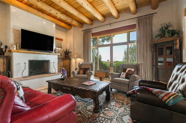 44 Lodge Cir Unit C, Santa Fe, NM 87506 - living room featuring a wood ceiling with exposed beams and a fireplace