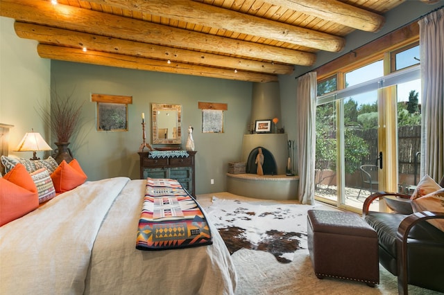 44 Lodge Cir Unit C, Santa Fe, NM 87506 - bedroom featuring access to exterior and a wooden ceiling with exposed beams