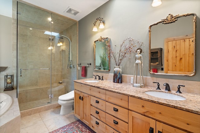 44 Lodge Cir Unit C, Santa Fe, NM 87506 - full bath with double vanity, a shower stall, a bath, and tile patterned flooring