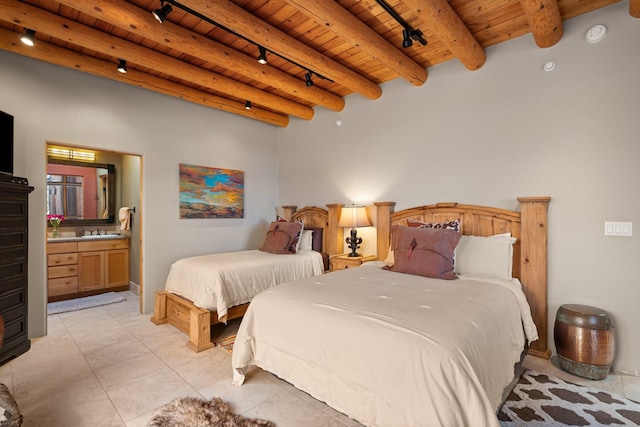 44 Lodge Cir Unit C, Santa Fe, NM 87506 - bedroom with a wood ceiling with exposed beams, track lighting, and ensuite bath