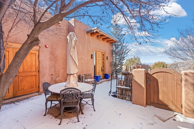 44 Lodge Cir Unit C, Santa Fe, NM 87506 - view of patio / terrace with a gate and outdoor dining area
