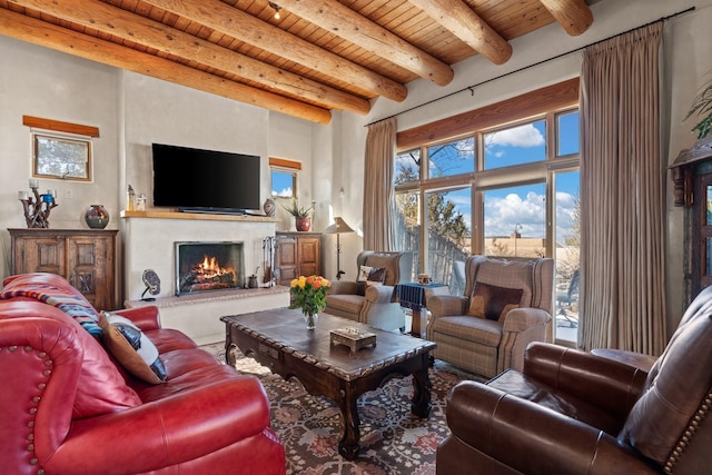 44 Lodge Cir Unit C, Santa Fe, NM 87506 - living room with a wood ceiling with exposed beams and a lit fireplace