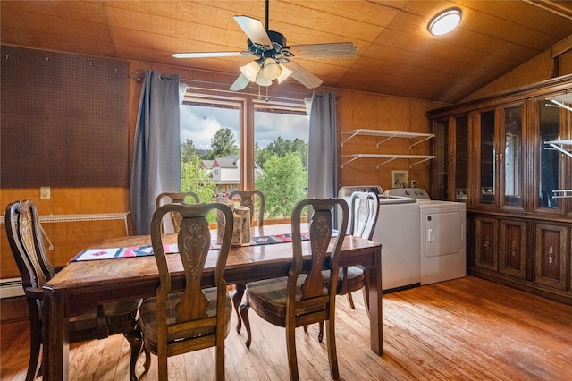 19 Canoe Ct, Jemez Springs, NM 87025 - dining space featuring washing machine and dryer, wood walls, ceiling fan, vaulted ceiling, and light wood-style flooring