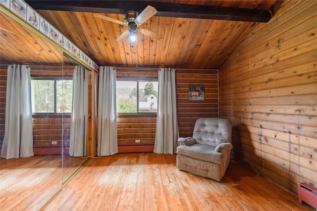 19 Canoe Ct, Jemez Springs, NM 87025 - living area with baseboard heating, hardwood / wood-style floors, a ceiling fan, vaulted ceiling, and wooden ceiling