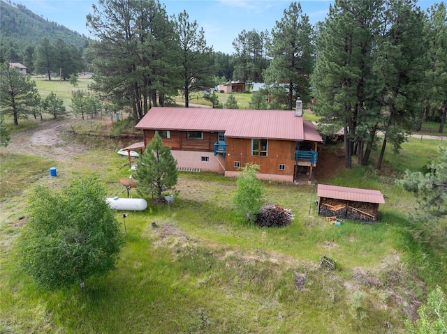 19 Canoe Ct, Jemez Springs, NM 87025 - back of house featuring a metal roof and crawl space