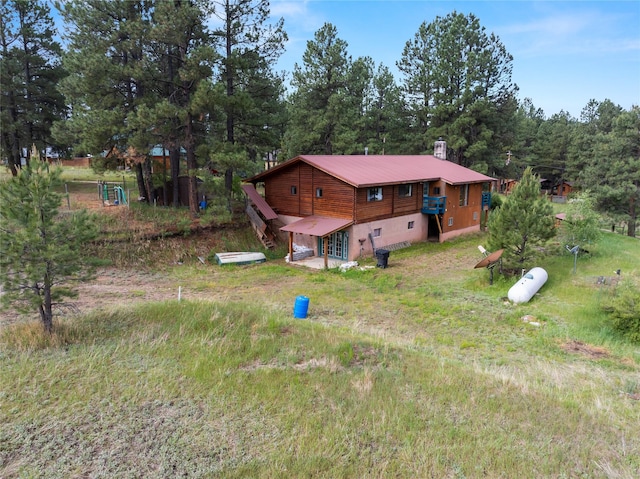 19 Canoe Ct, Jemez Springs, NM 87025 - rear view of house featuring a metal roof