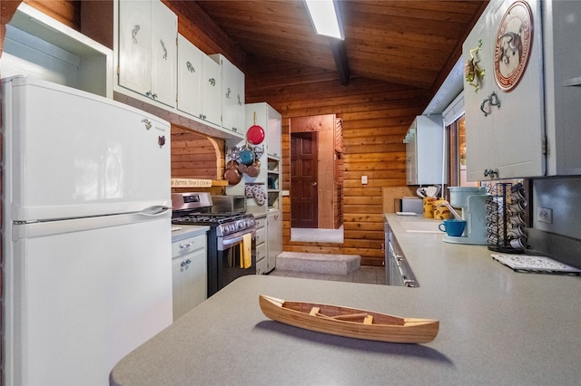 19 Canoe Ct, Jemez Springs, NM 87025 - kitchen featuring freestanding refrigerator, stainless steel gas stove, wooden ceiling, light countertops, and lofted ceiling