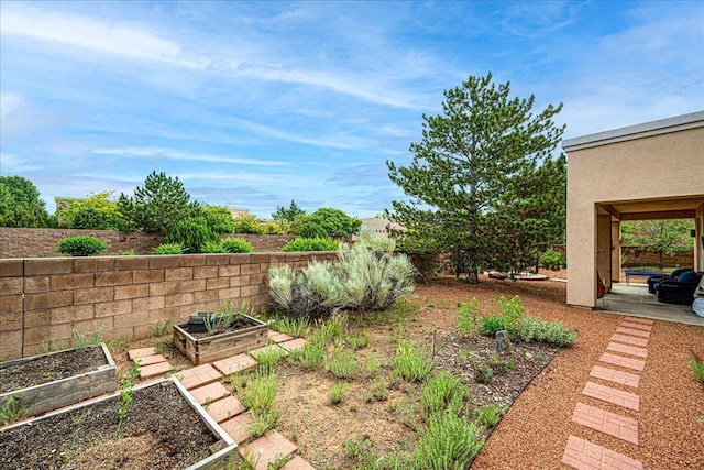 3 Hunters Run, Santa Fe, NM 87508 - fenced backyard featuring a vegetable garden and a patio