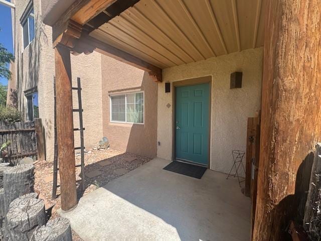 2210 Miguel Chavez Unit 1816, Santa Fe, NM 87505 - entrance to property featuring stucco siding and a patio area