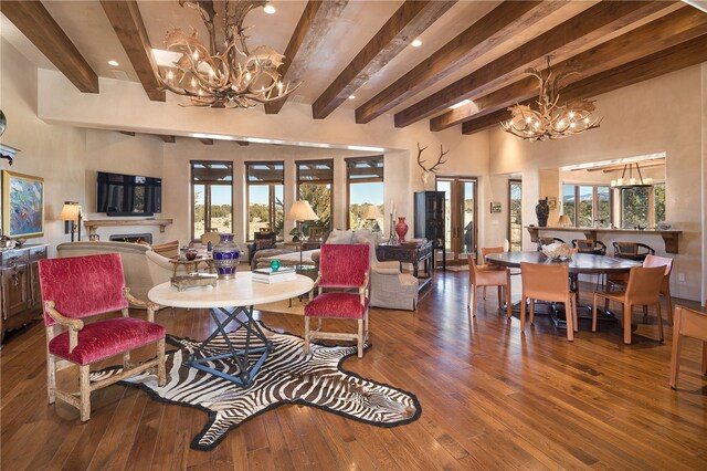 5 N Brisa Fresca, Santa Fe, NM 87506 - living room featuring a chandelier, beam ceiling, hardwood / wood-style floors, a warm lit fireplace, and recessed lighting