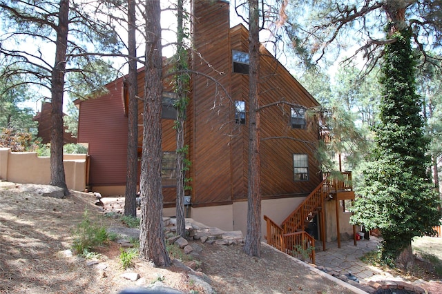 986 Alamo Rd, Los Alamos, NM 87544 - view of property exterior with stairway and a wooden deck