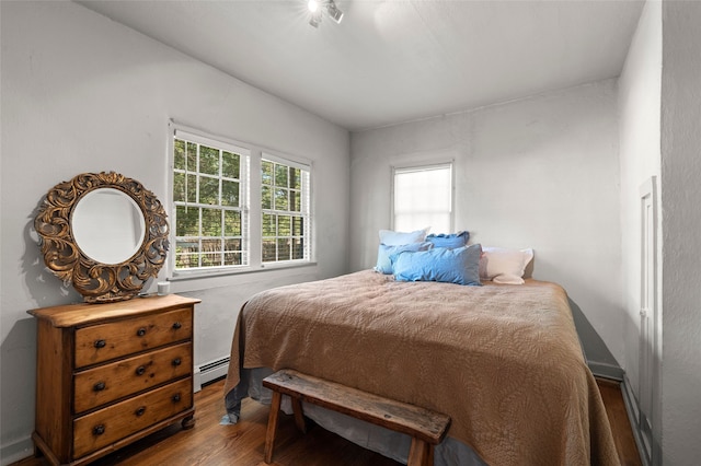 3B Camino Miguel, Santa Fe, NM 87506 - bedroom featuring baseboard heating and wood finished floors
