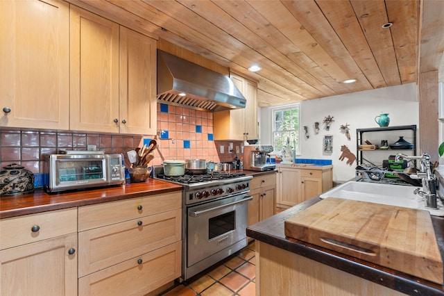 3B Camino Miguel, Santa Fe, NM 87506 - kitchen with designer stove, wall chimney exhaust hood, butcher block countertops, decorative backsplash, and wood ceiling