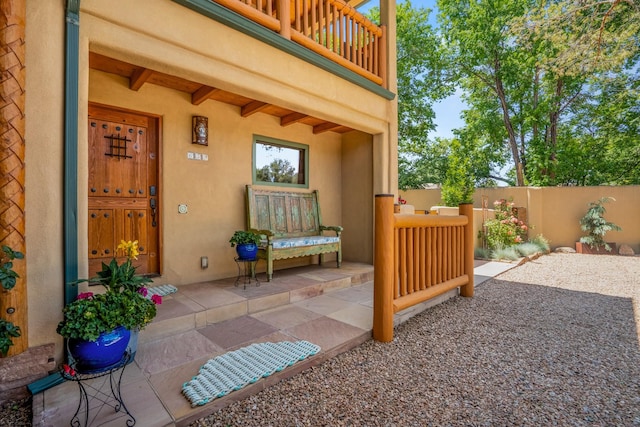 659 Bishops Ldg Unit 1 & 2, Santa Fe, NM 87501 - property entrance featuring a balcony and stucco siding