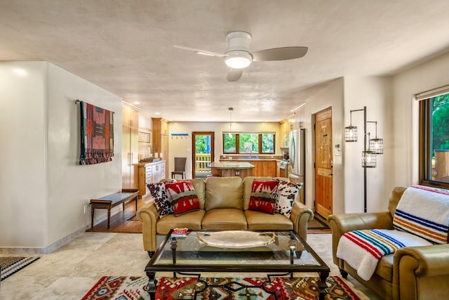 659 Bishops Ldg Unit 1 & 2, Santa Fe, NM 87501 - living room featuring a ceiling fan and baseboards