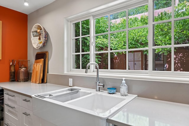 359 Garcia St, Santa Fe, NM 87501 - kitchen with white cabinets, light countertops, and plenty of natural light