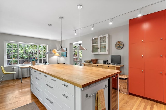 359 Garcia St, Santa Fe, NM 87501 - kitchen with radiator heating unit, wooden counters, and rail lighting